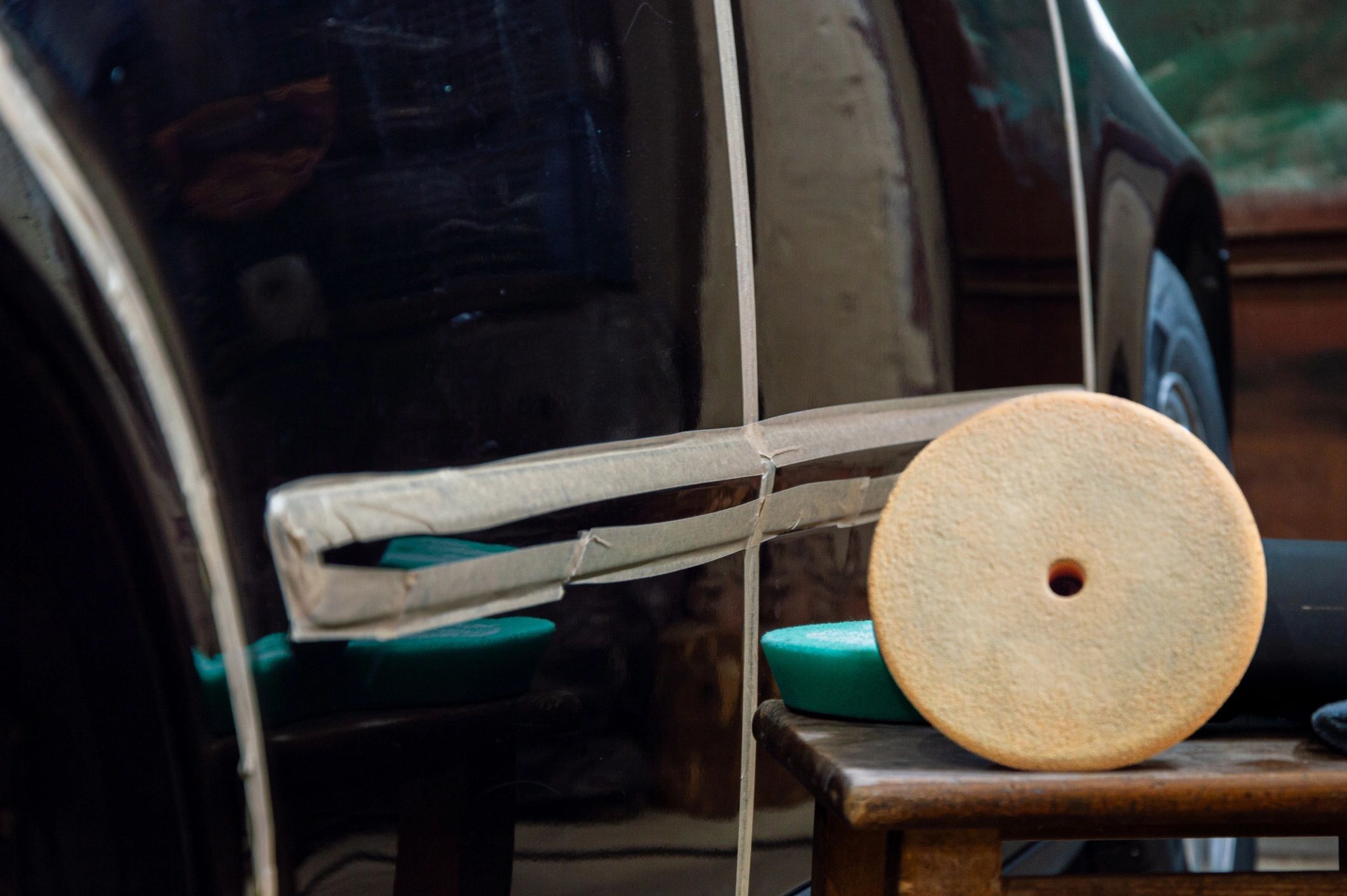 Car being polished with a machine polisher (paint correction process)