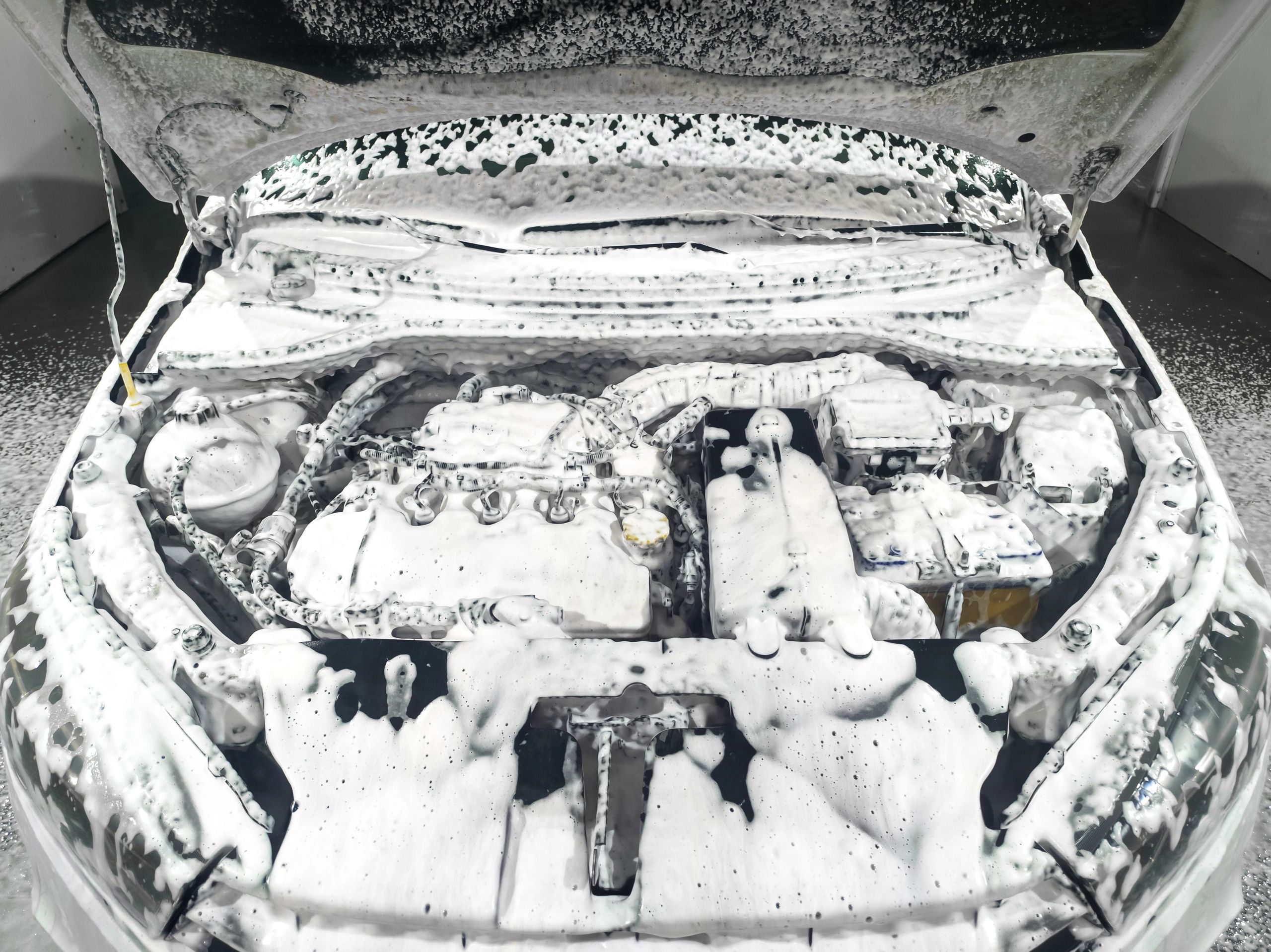 Detailing foam applied during a car wash